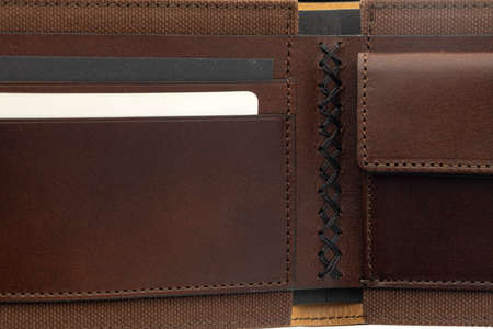 Brown shiny wallet isolated on white background