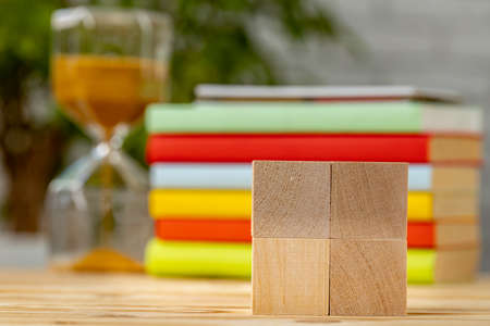 Blank wooden cubes with copy space for your design on office working table