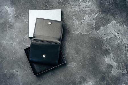 New black leather wallet on dark backgroundの写真素材