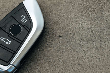 Modern automobile car key on black concrete backgroundの写真素材