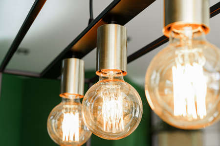 Creative loft style lamp with shining lightbulb