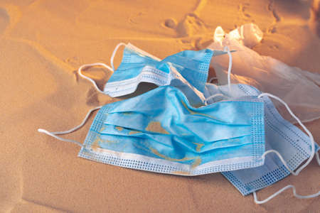 Protective facial mask on the natural outdoors beach background