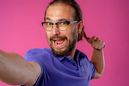 Portrait of a funny nerd man in glasses