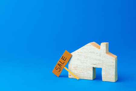 Wooden house model and for sale signの写真素材