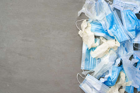 Surgical gloves and medical protective mask on a dark background.の写真素材