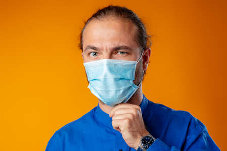 Middle-aged caucasian man wearing medical face mask.の写真素材