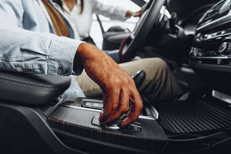 Male hand on gear shift lever in a luxury carの写真素材