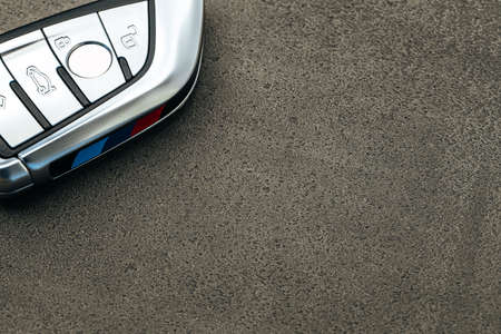 Modern automobile car key on black concrete backgroundの写真素材