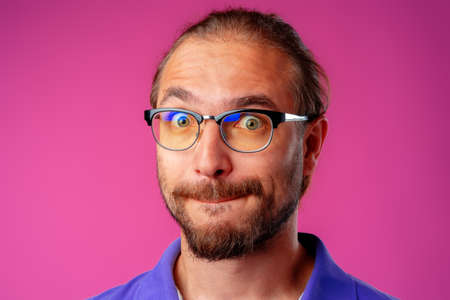 Portrait of a funny nerd man in glassesの写真素材