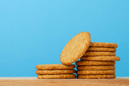 Stack of round oat cookies on paper background