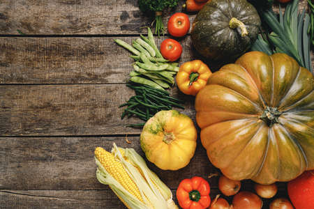 Beautiful arrengament of autumn vegetables on wooden table
