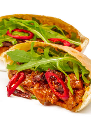 Half cut beef tortilla wrap on white backgroundの写真素材