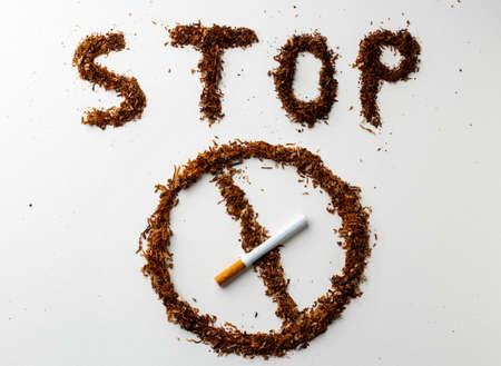 Inscription word STOP SMOKING made out of cigarettes top viewの写真素材