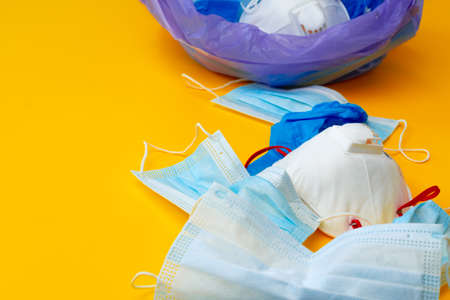 Protective equipment, masks and gloves, on an orange backgroundの写真素材