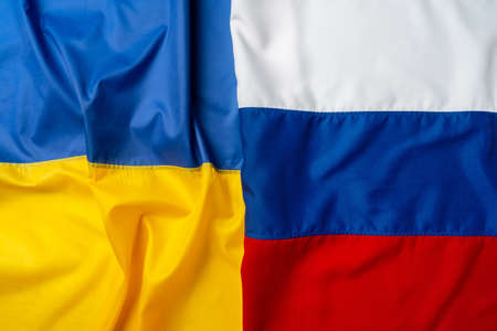 Flags of Russia and Ukraine folded togetherの写真素材