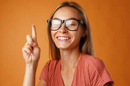 Young smart woman in glasses came up with the ideaの写真素材