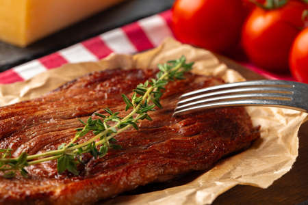 Grilled beef steak served on plate close upの写真素材