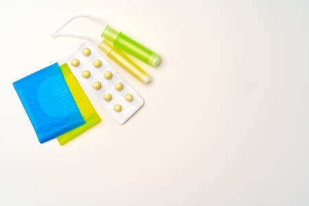 Flat lay of Pads, tampons and pills top viewの写真素材
