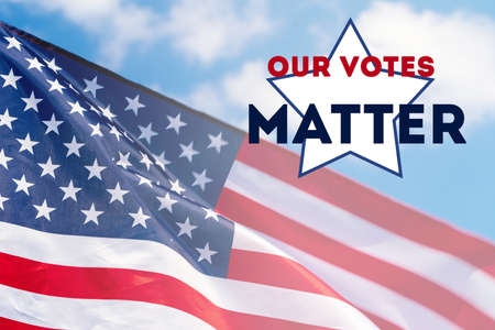 Our votes matter, American flag waving in the wind against blue sky