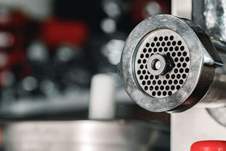 Indutrial new meat grinder close up in a shop