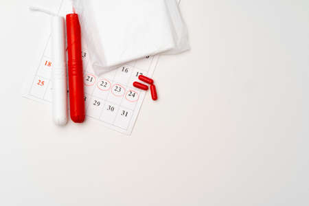 Menstruation calendar with sanitary pads and tampons, pillsの写真素材