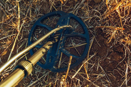 Close up of a metal detector device in a rural fieldの写真素材