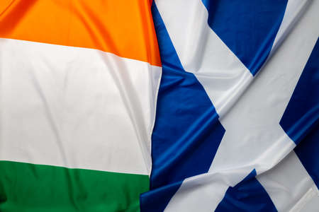 Flags of Scotland and Ireland folded togetherの写真素材