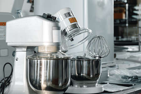 Industrial mixers on shelf in shop close up