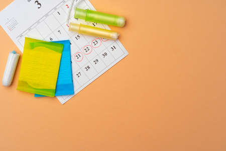 Female menstruation calendar and hygienic pads top viewの写真素材