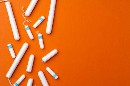 Medical female tampons on orange background top viewの写真素材