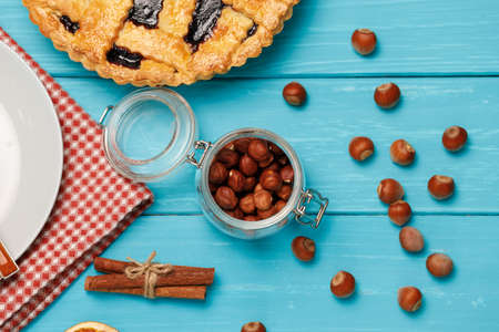 Berry tart pie on blue wooden background