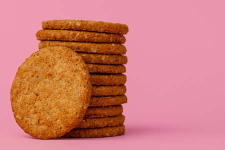 Stack of round oat cookies on paper backgroundの写真素材