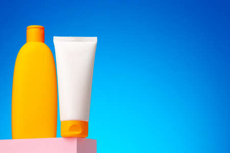 Skincare beauty products container against blue background
