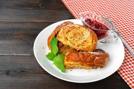 Georgian baked sweet nut roll with berry sauce