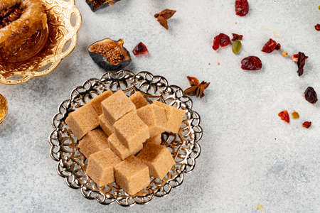 Silver plate with lumps of sugar on tableの写真素材