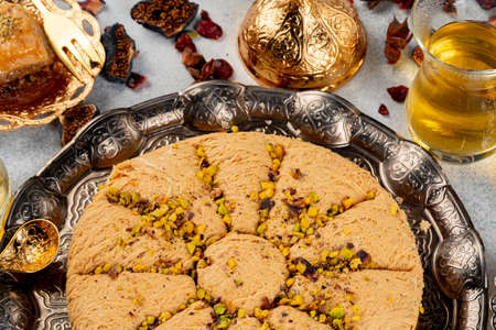 Turkish pastries and scattered dry fruits on tableの写真素材