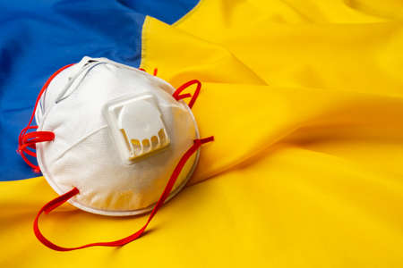Medical face masks on flag of Ukraineの写真素材