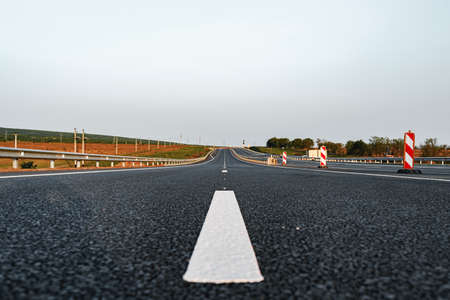 White marking line on asphalt road on highway