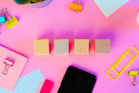 Top view of wooden block with copy space on pink background