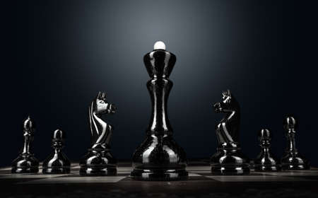 Chess board with figures on dark backgroundの写真素材