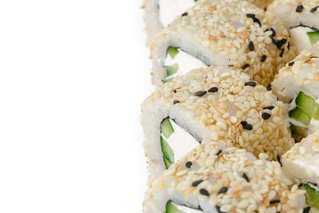 Sushi roll with tuna and sesame isolated on whiteの写真素材