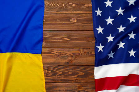 Flags of USA and Ukraine folded togetherの写真素材