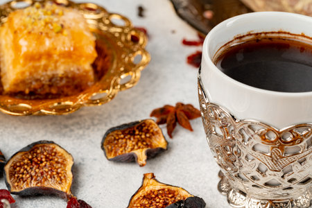 Cup of coffee and turkish pastries on dark surfaceの写真素材