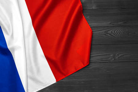 Flag of France on wooden bakground, copy space