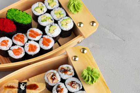 Set of maki sushi on wooden boat trayの写真素材