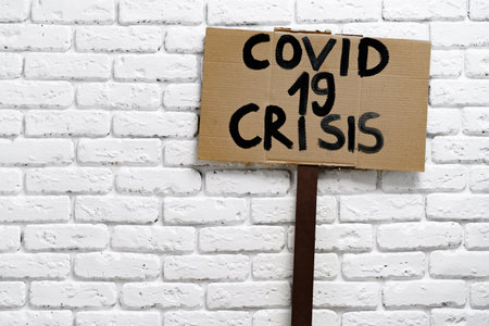 Protest placards with Covid 19 crisis textの写真素材