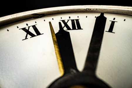 Old metal watch dial in dark macro photoの写真素材