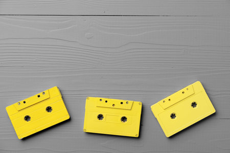 Yellow audio cassettes on gray background top viewの写真素材