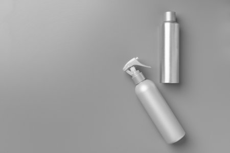 Gray haircare product on gray background top viewの写真素材