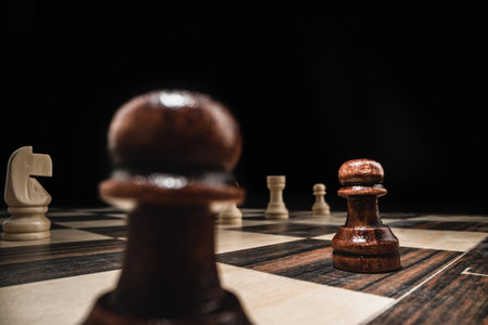 Chess game with chess pieces against black background